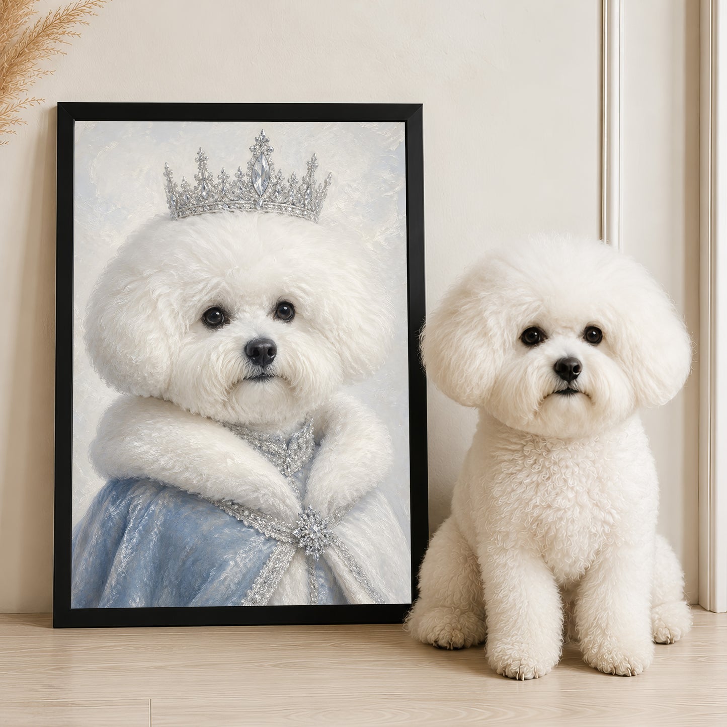 A white poodle wearing a tiara is sitting next to a framed picture of the same poodle in a tiara.