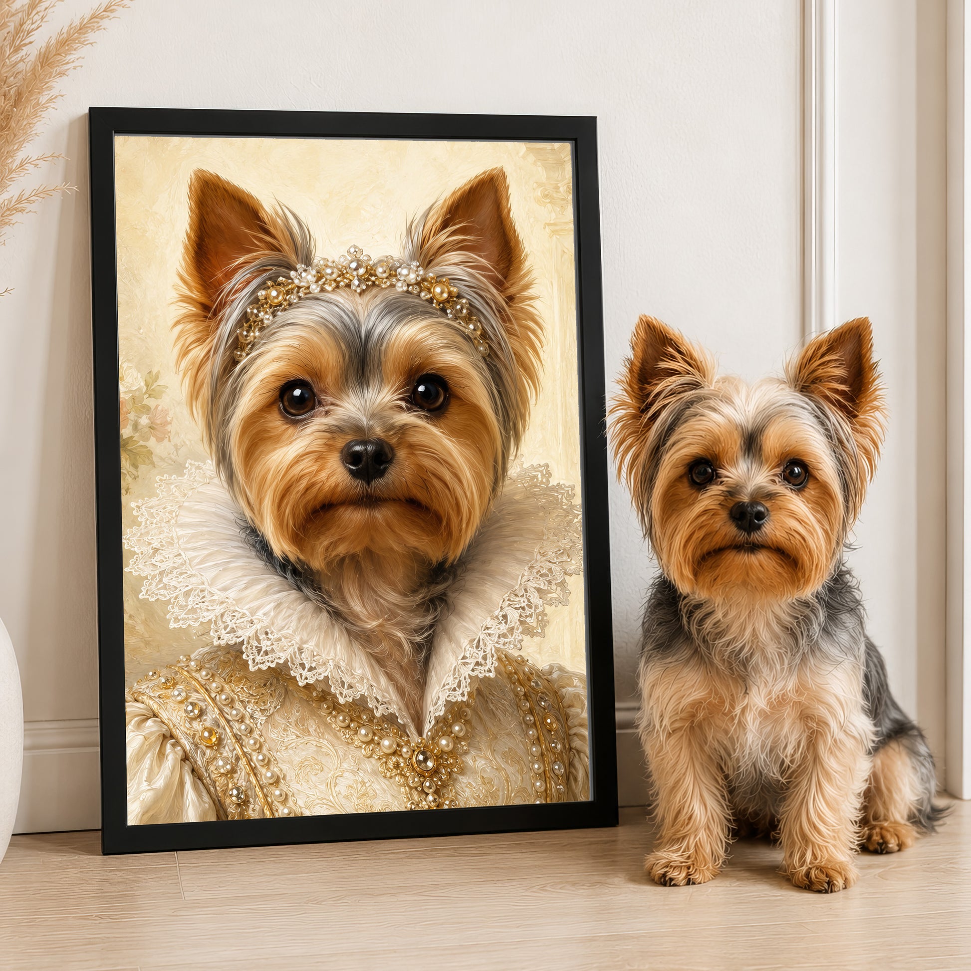 A Yorkshire Terrier wearing a golden dress and headpiece is standing next to a framed image of the same dog in a regal pose.