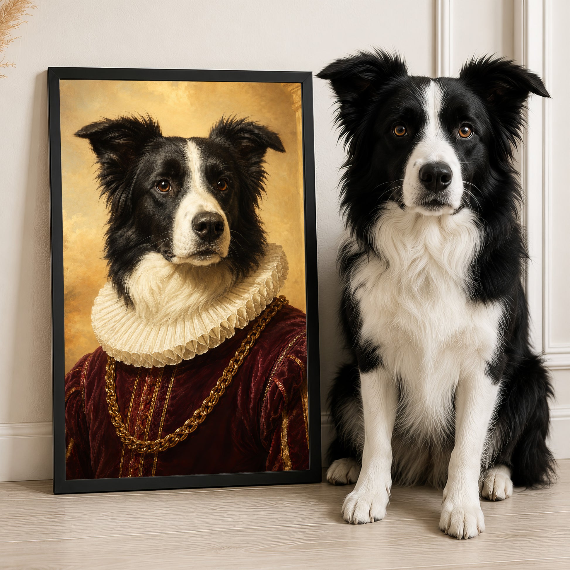 A black and white dog wearing a red and gold outfit, resembling a portrait, is sitting next to a framed image of the same dog in a similar outfit.